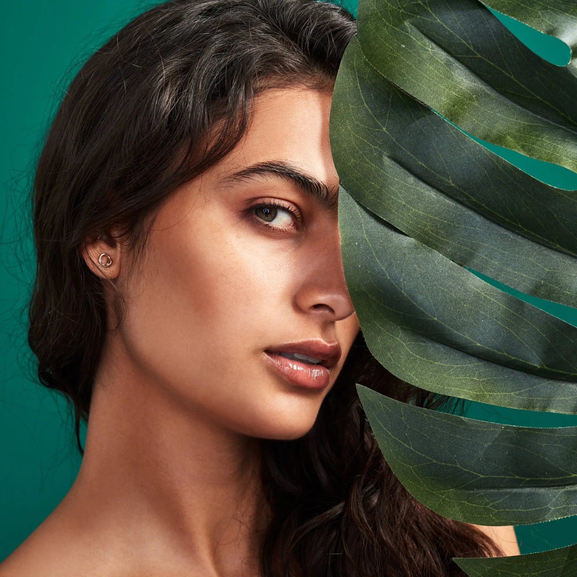 Profile portrait of a woman with long dark hair enjoying Sulphate-Free Shampoo benefits.