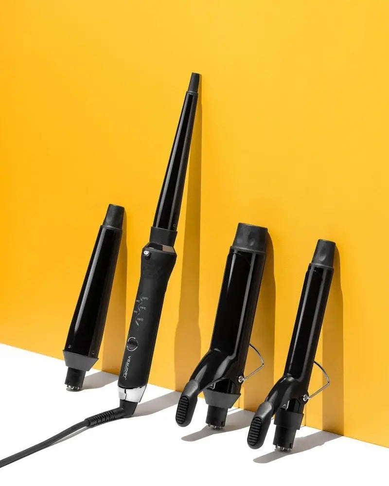 Set of black hair styling tools including curling wands and straighteners for versatile looks
