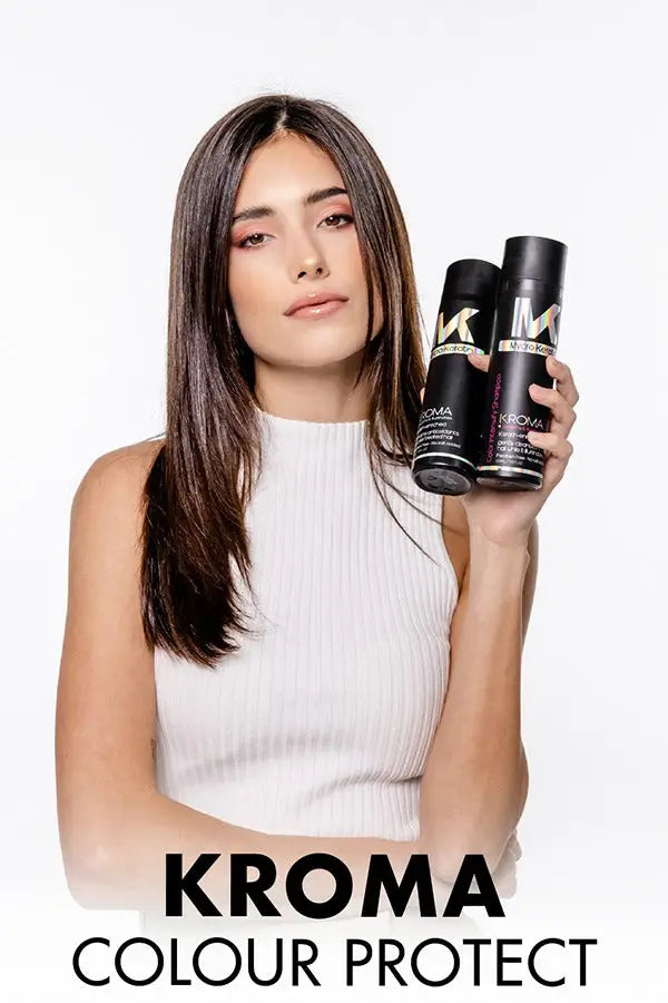 Woman with long dark hair showcasing Kroma Colour Protect for vibrant keratin care.