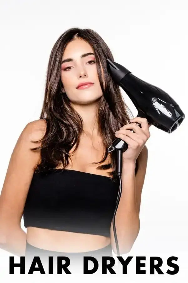 Black handheld hair dryer being used by a woman in a black top.
