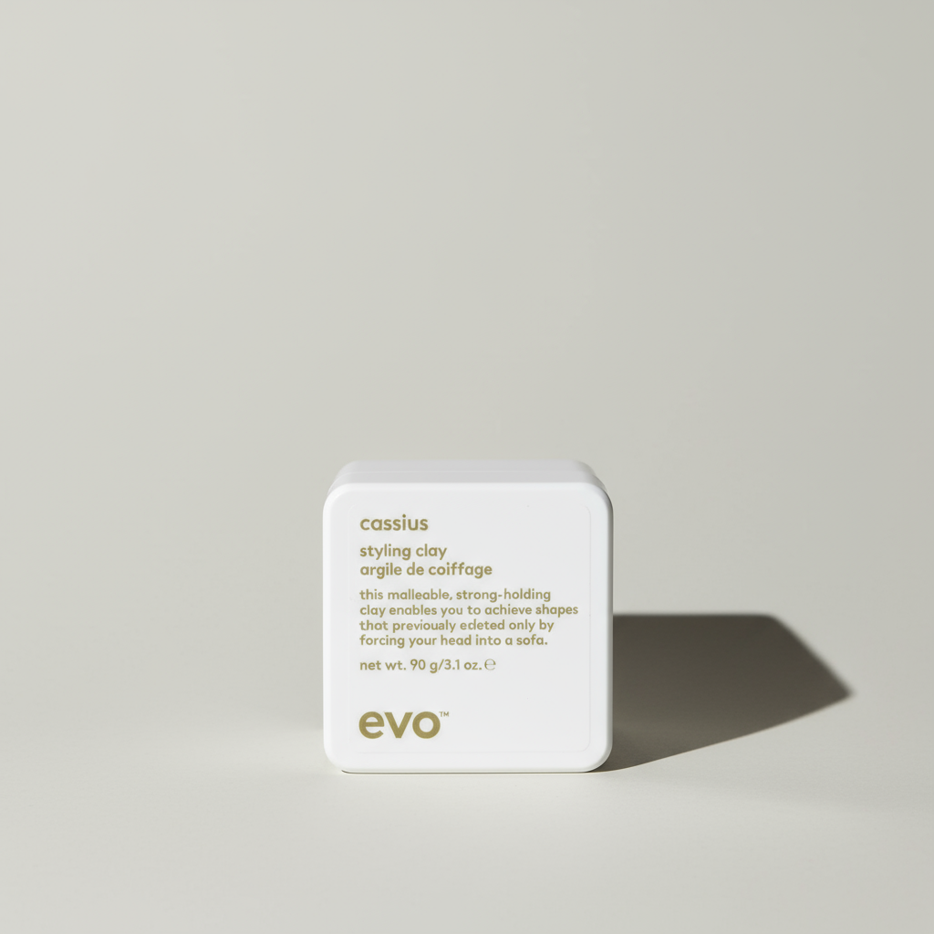 EVO Cassius strong hold hair clay for men in a white square container with gold text