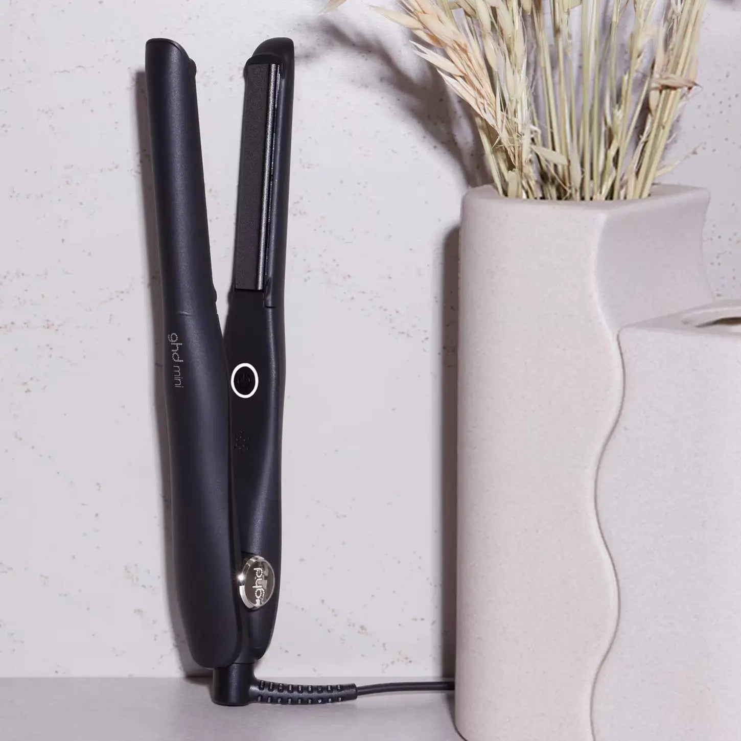 Black ghd Mini Hair Straightener with ceramic floating plates and cord