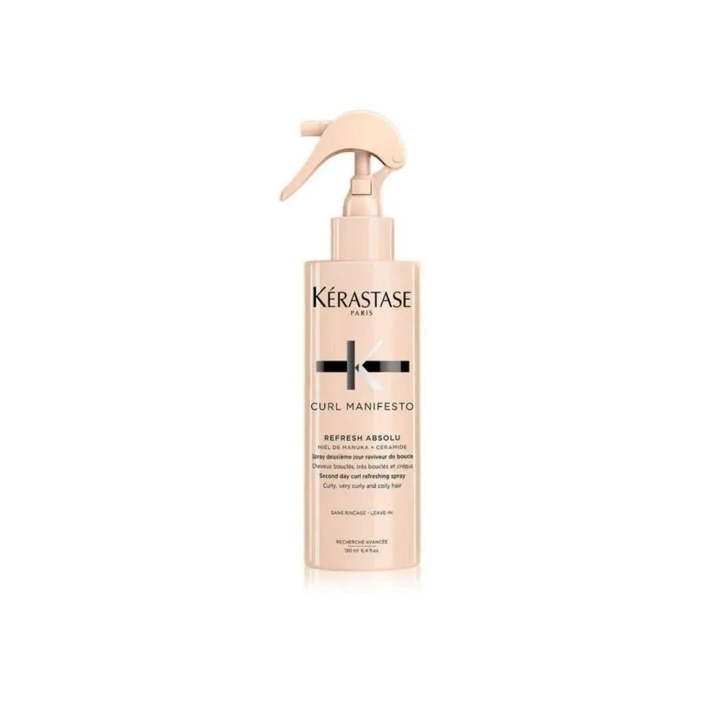 Light pink bottle of Kerastase Curl Manifesto Refresh Absolu Hair Spray