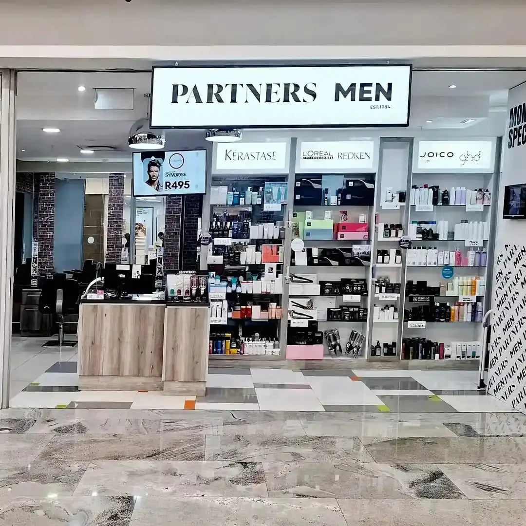 Men’s beauty and grooming products store with a ’Partners Men’ sign.