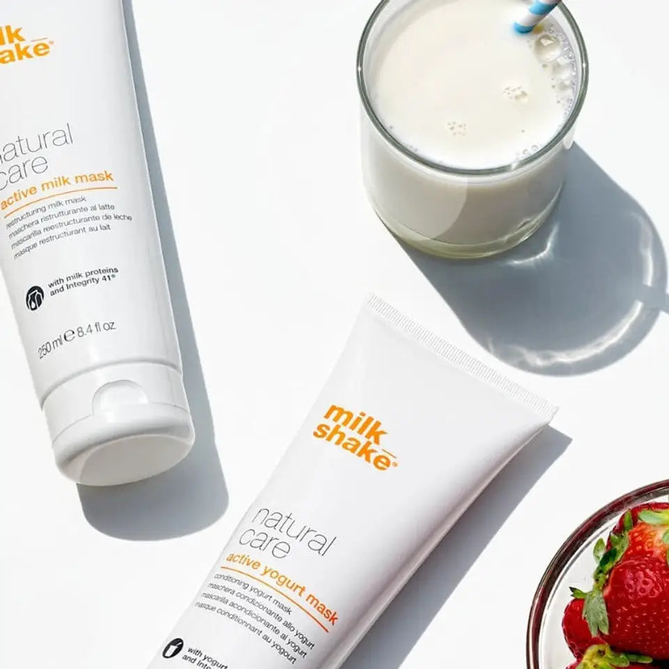 Milkshake Active Yogurt Mask natural care treatment in white tube with glass of milk and strawberries