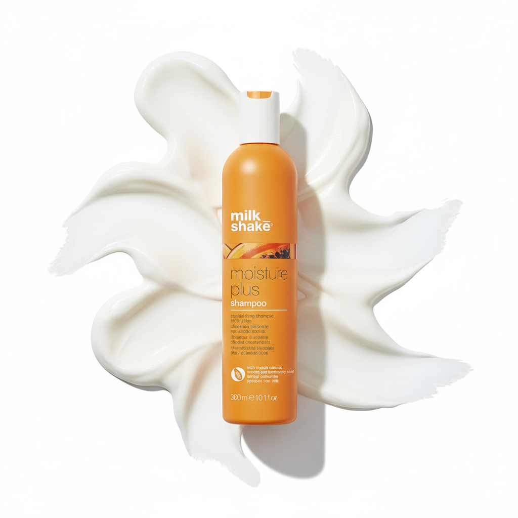 Milkshake Moisture Plus Shampoo in orange bottle with cream texture background for hydration