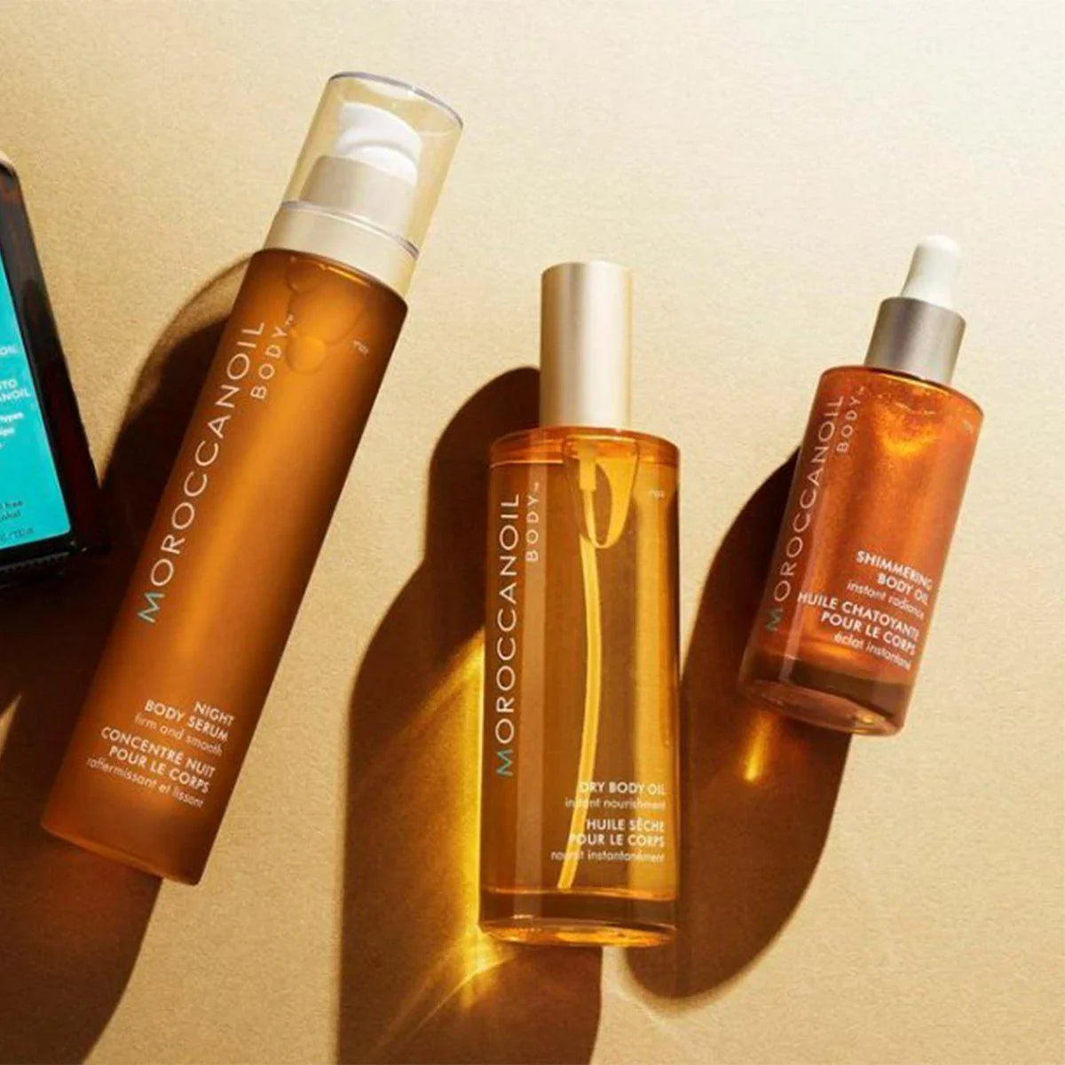 Moroccanoil Body Oil Collection: Night Serum, Dry Oil & Shimmering Body Oil. Skincare products for radiant, moisturized skin.