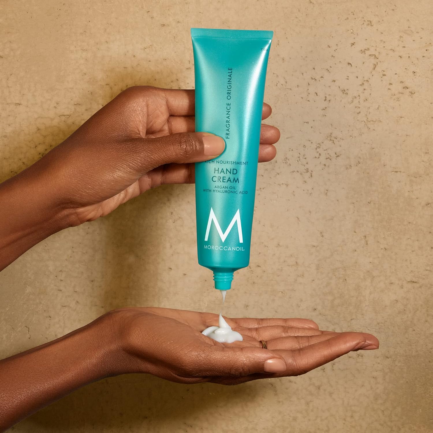 Luxuriously hydrate with Moroccanoil Hand Cream Original 100ml, perfect for nourishing hands, nails, and cuticles.