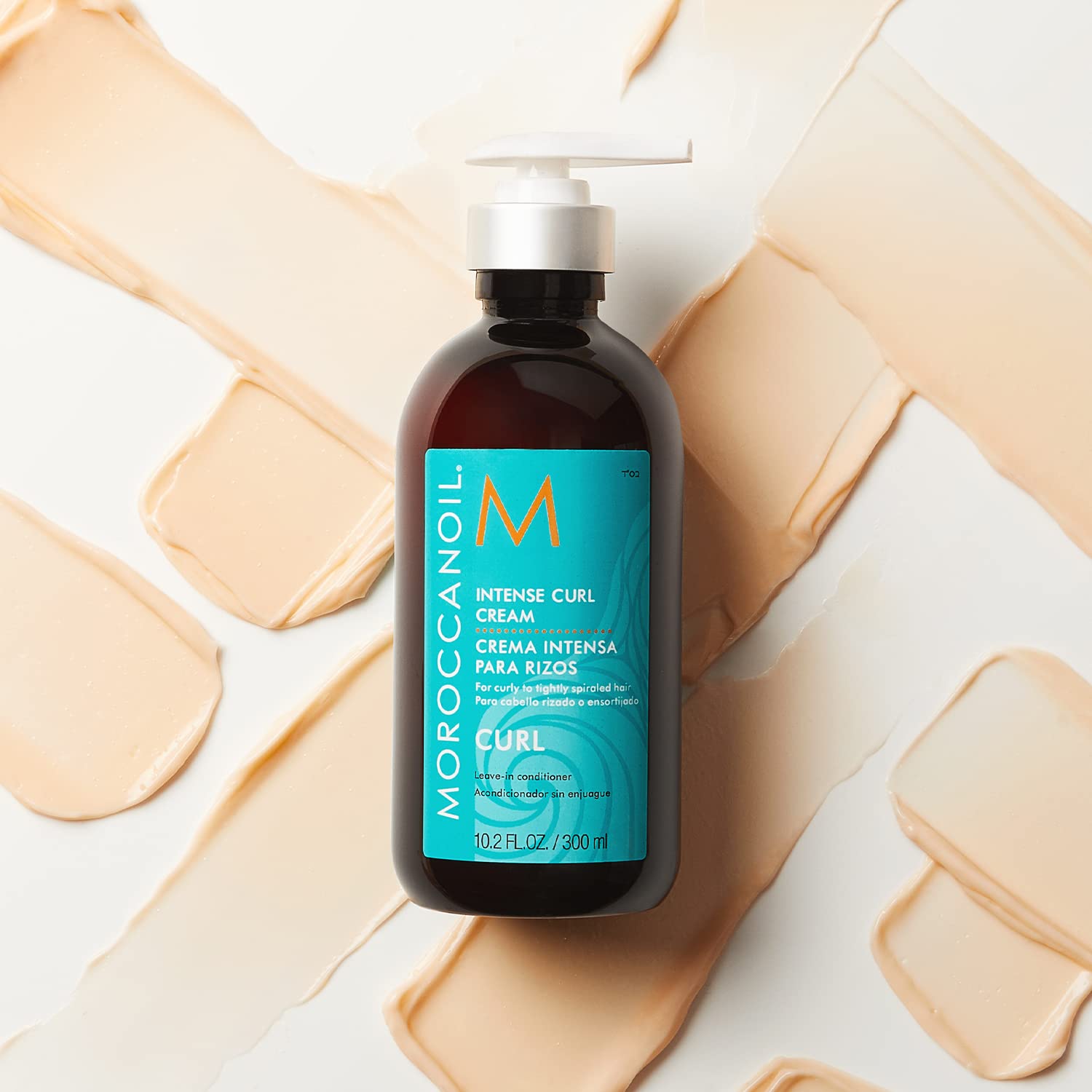 Moroccanoil Intense Curl Cream 300ml hydrates and defines curls for soft, manageable hair. Perfect for curly styles.