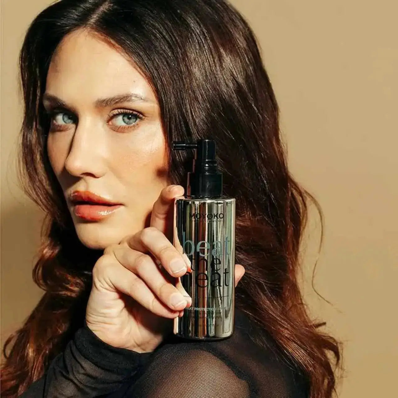 Moyoko Beat the Heat Spray: Hair Product for Heat Protection & Styling, Model Holding Beauty Product, Heat Protectant, Hair Care