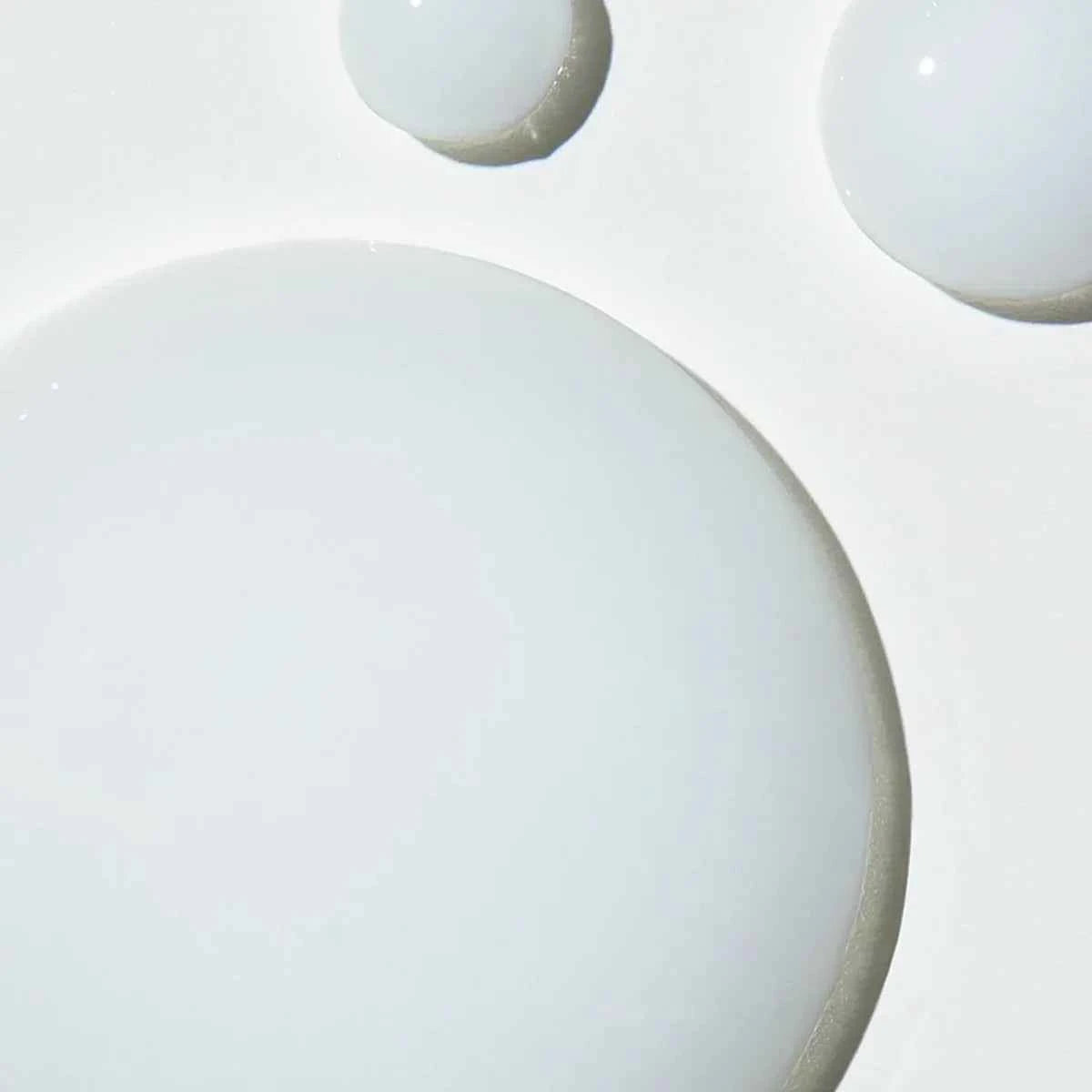 Close-up of Pureology Colour Fanatic treatment showcasing its creamy texture on a white surface