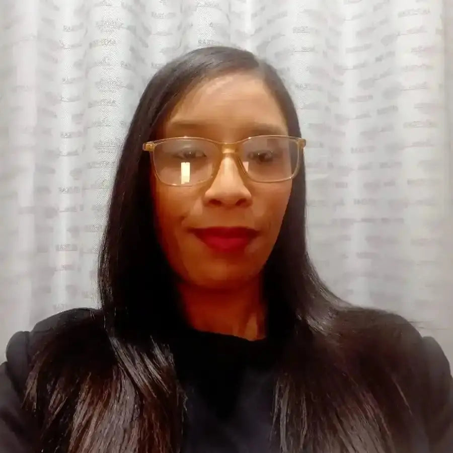 A selfie showing someone wearing glasses and bright red lipstick.