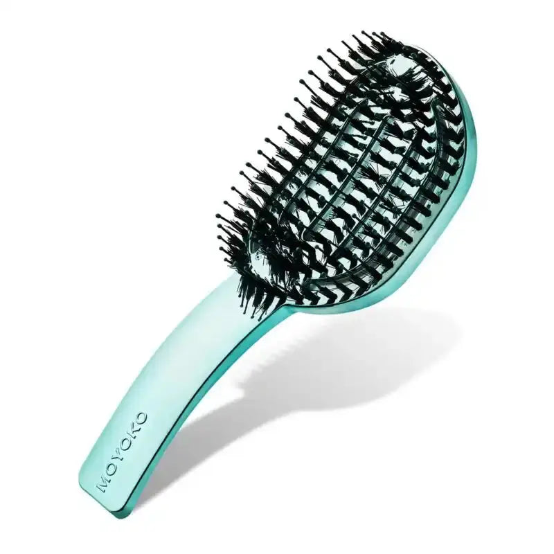 A detangling brush, perfect for minimizing breakage and pain, displayed in its retail box, ready for purchase.