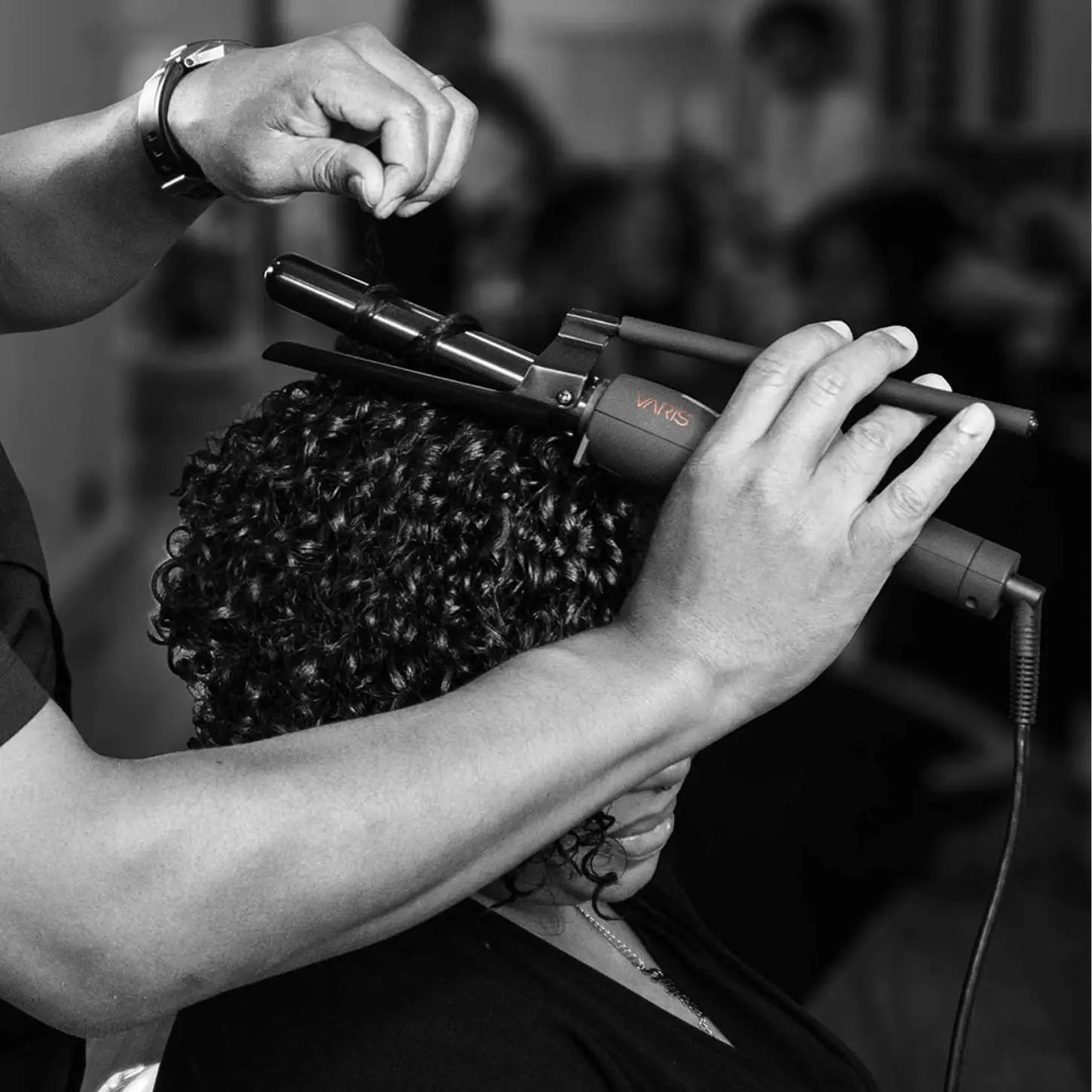 VARIS Curling Iron Hairstyling: Curls being created with professional spring curler.