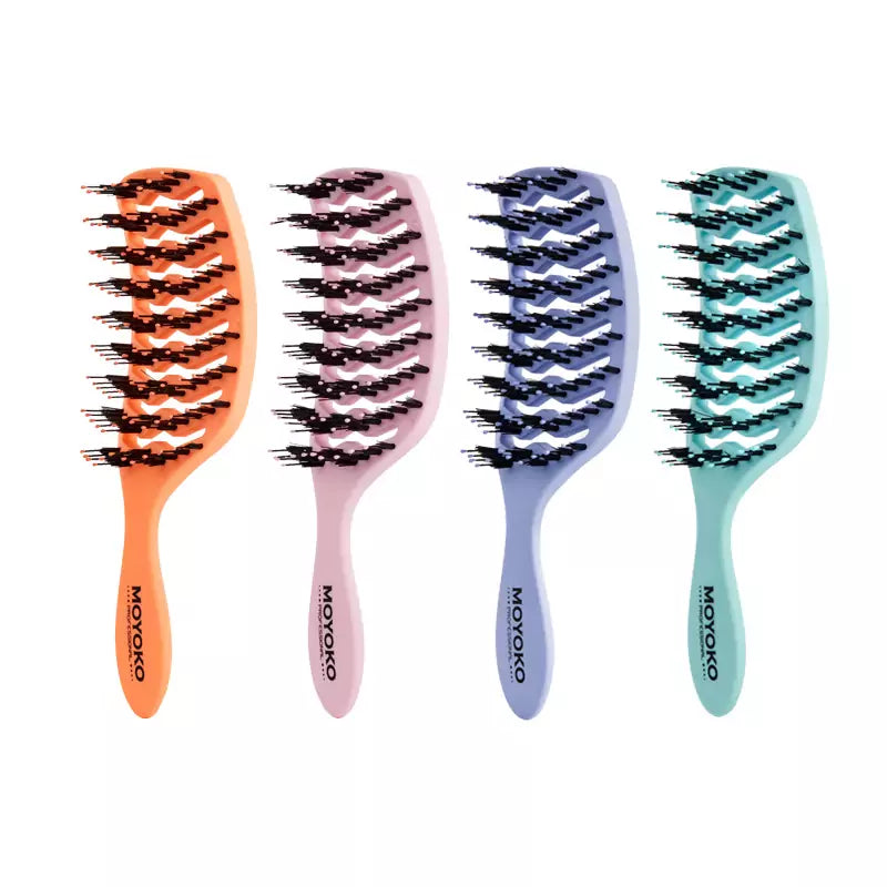 Set of four Moyoko detangling brushes with flexible bristles in vibrant colors.