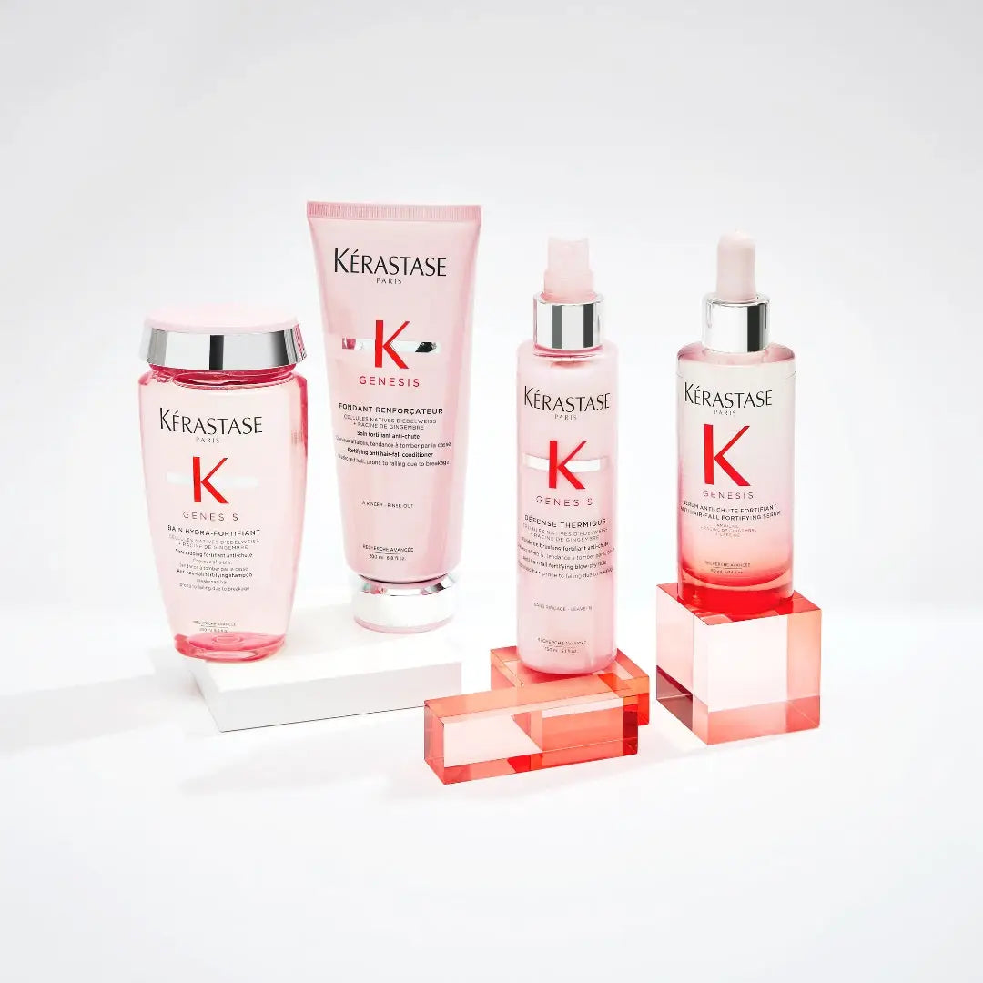 Kérastase hair care products featuring Edelweiss Native Cells and Ginger Root in pink and white packaging