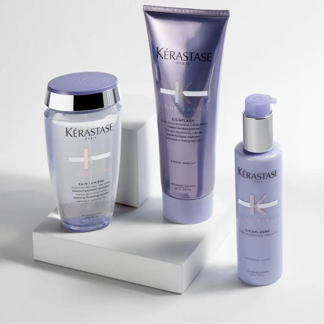 Kérastase hair care product line with purple and silver packaging, featuring Blond Absolu.