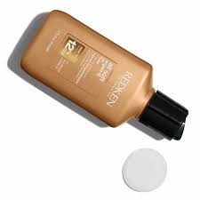 Gold L’Oréal hair product bottle for achieving silky soft hair in hair care.