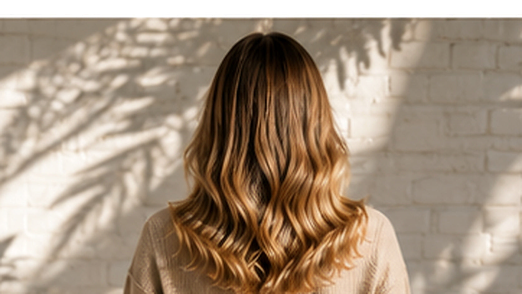 Glossy salon-finished hair with smooth reflective shine, illustrating the benefits of hair gloss.