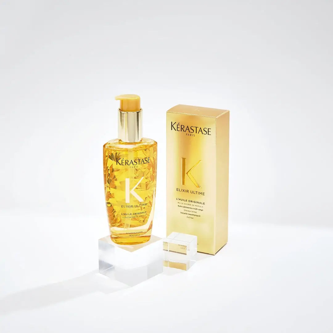 Golden Kérastase Elixir Ultime hair oil and packaging for luxurious hair care.