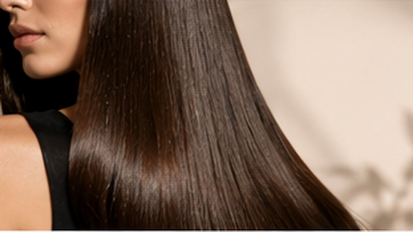 Smooth glossy straight brunette hair after a keratin smoothing treatment