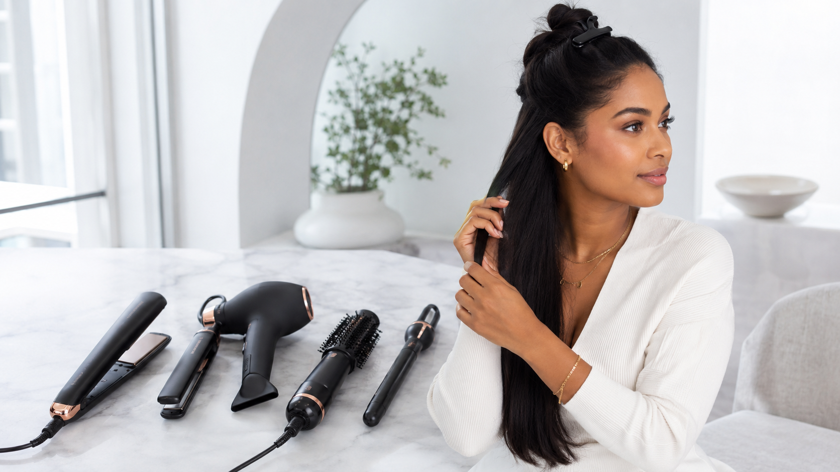 Woman with professional Moyoko styling tools in a bright studio