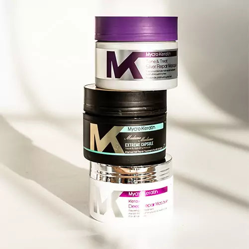 Stack of three Mycro Keratin products showcasing innovative keratin treatments for hair care.