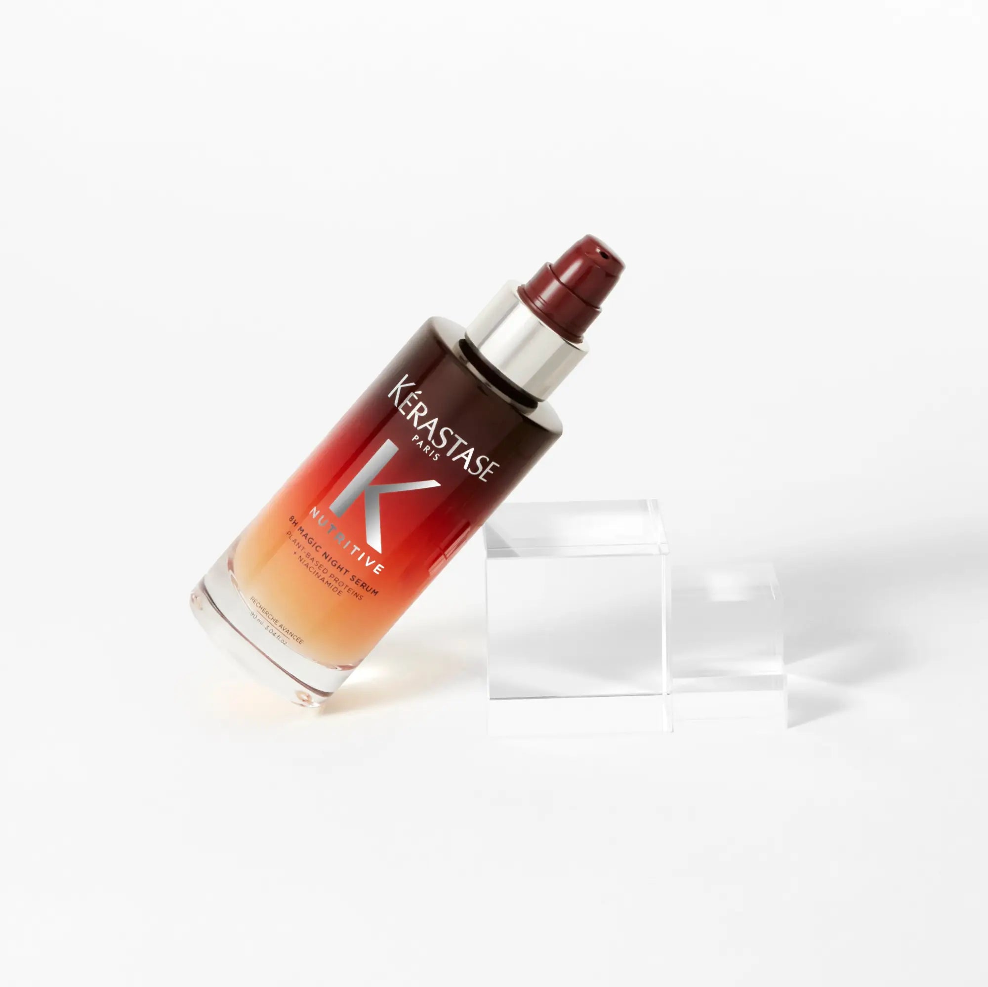 Kérastase Nutritive bottle with ombré red-orange gradient for damaged hair care