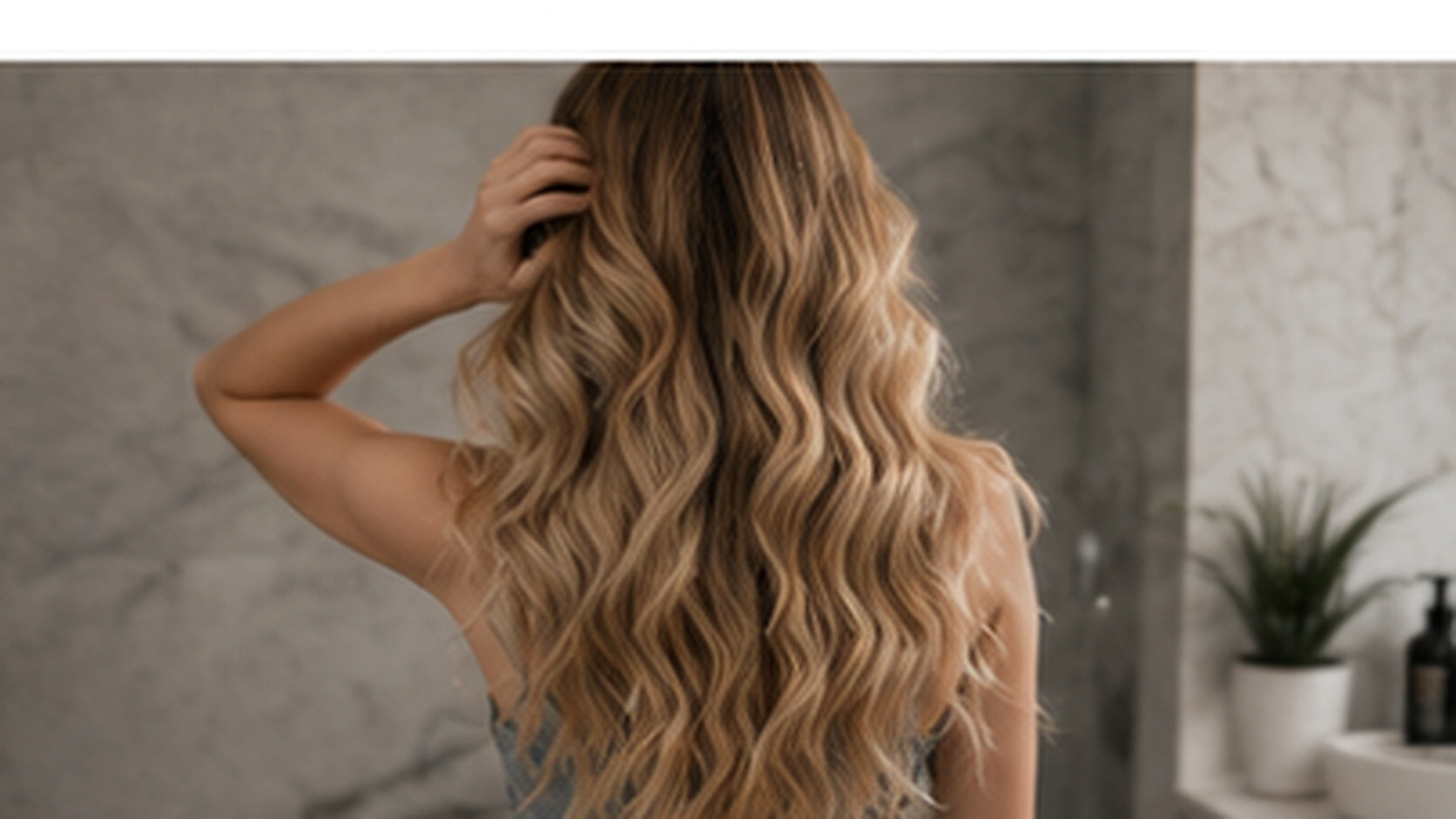 Long soft blonde hair in a calm evening haircare setting