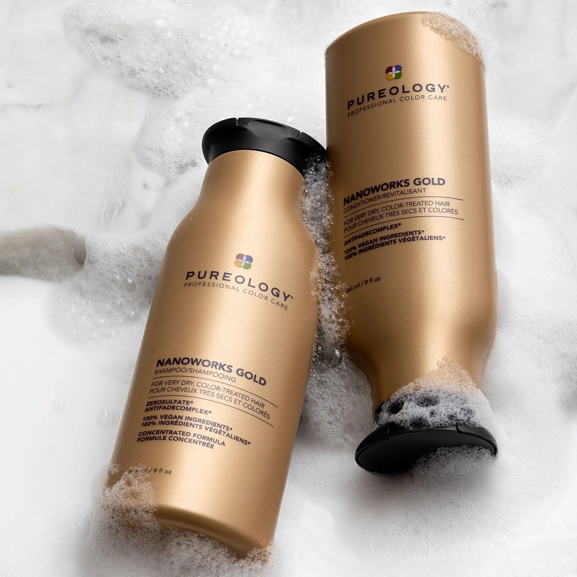 Gold-colored Pureology’s Shampoo and conditioner bottles from the Nanoworks Gold line.