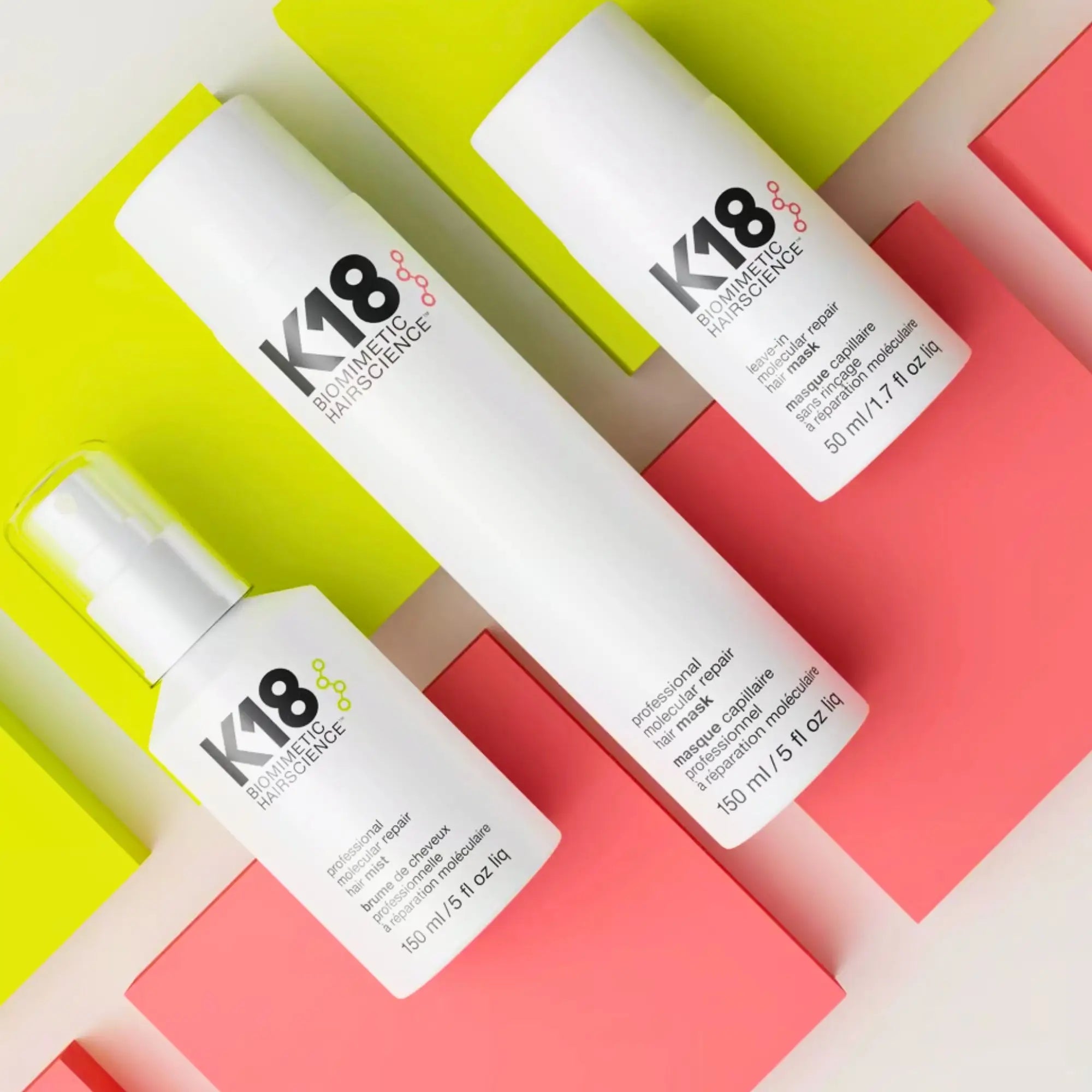 White K18 bottles on a colorful background, embodying molecular repair for hair repair.