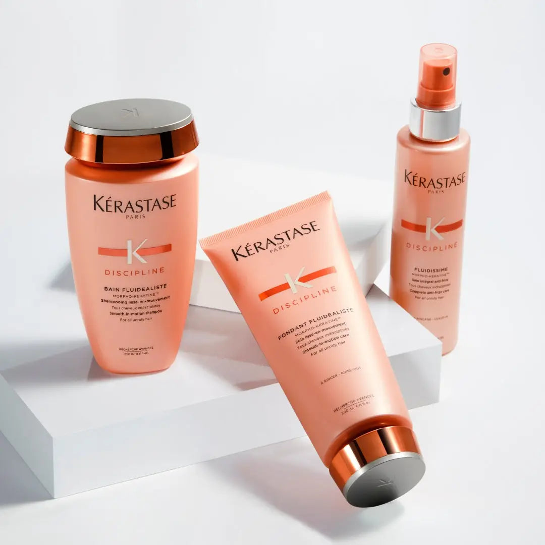 Kérastase Discipline hair care products for unruly hair in peach and copper packaging