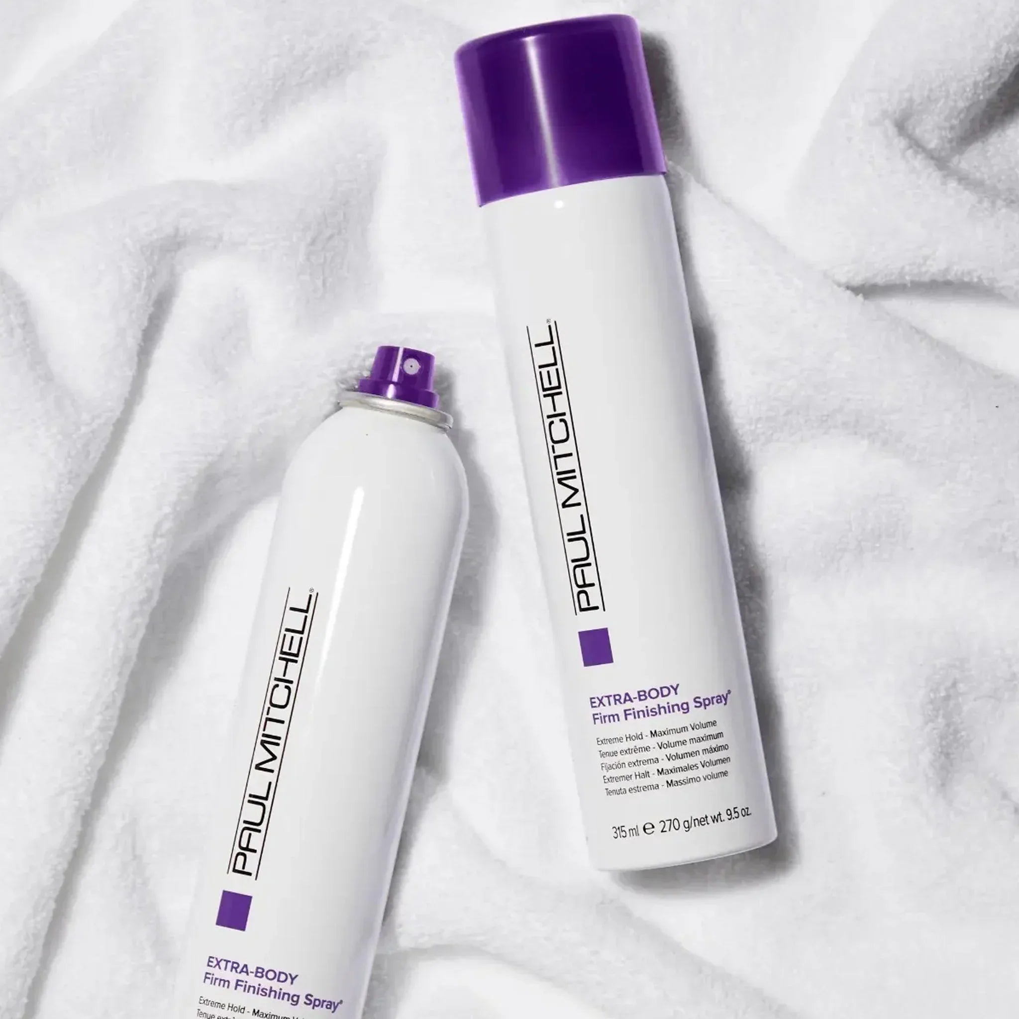 Hair care product bottles with purple caps from Paul Mitchell Extra Body Range.