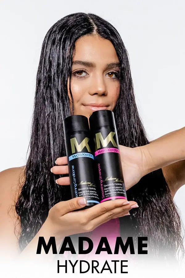 Woman with long dark hair holding Madame Madam Shampoo and Mycro Keratin products.