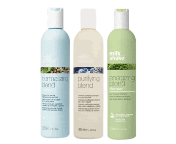 Three Milkshake Scalp Care shampoo bottles on a shelf in a salon display