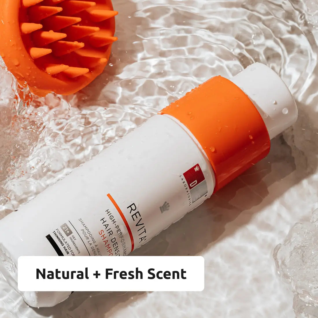 Natural + Fresh Scent hair care product in an orange and white bottle for salon quality.