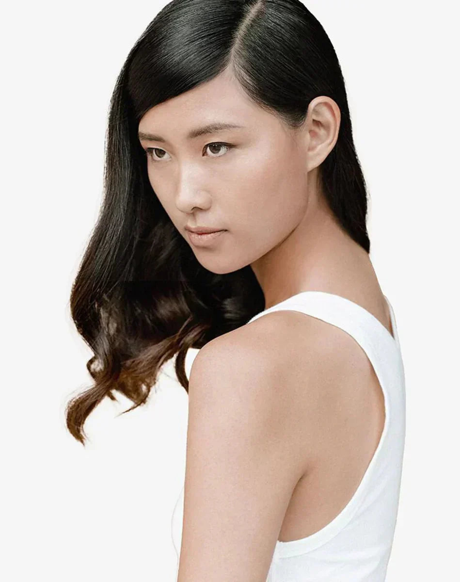 Young Asian woman with long hair, featuring Kerastase Specifique for oily scalp & hair.