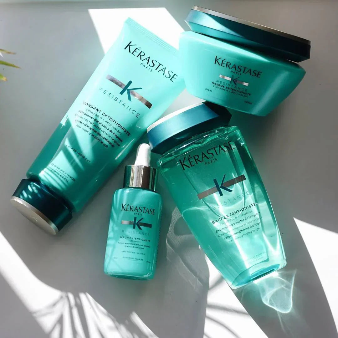 Collection of Kérastase Resistance hair care products in teal packaging.