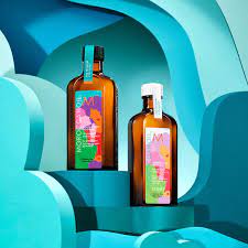 Vibrant Moroccanoil brand liquor bottles with artistic labels showcasing innovative formulas.