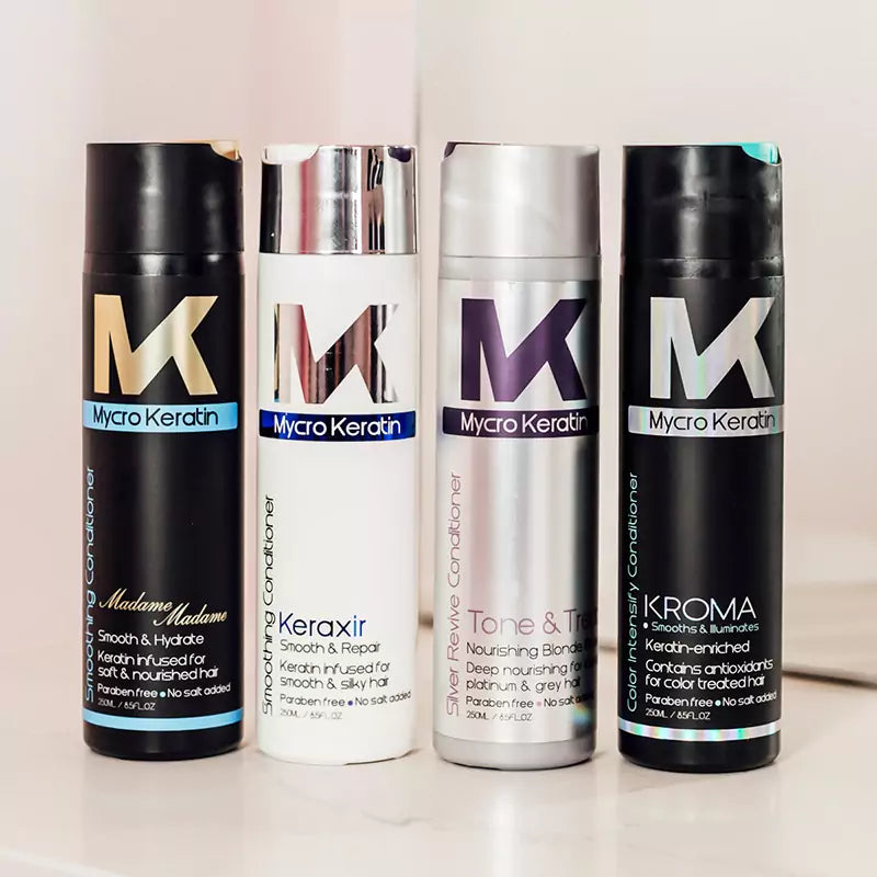 Four Mycro Keratin hair care product bottles from the Mycro Keratin Conditioner collection.