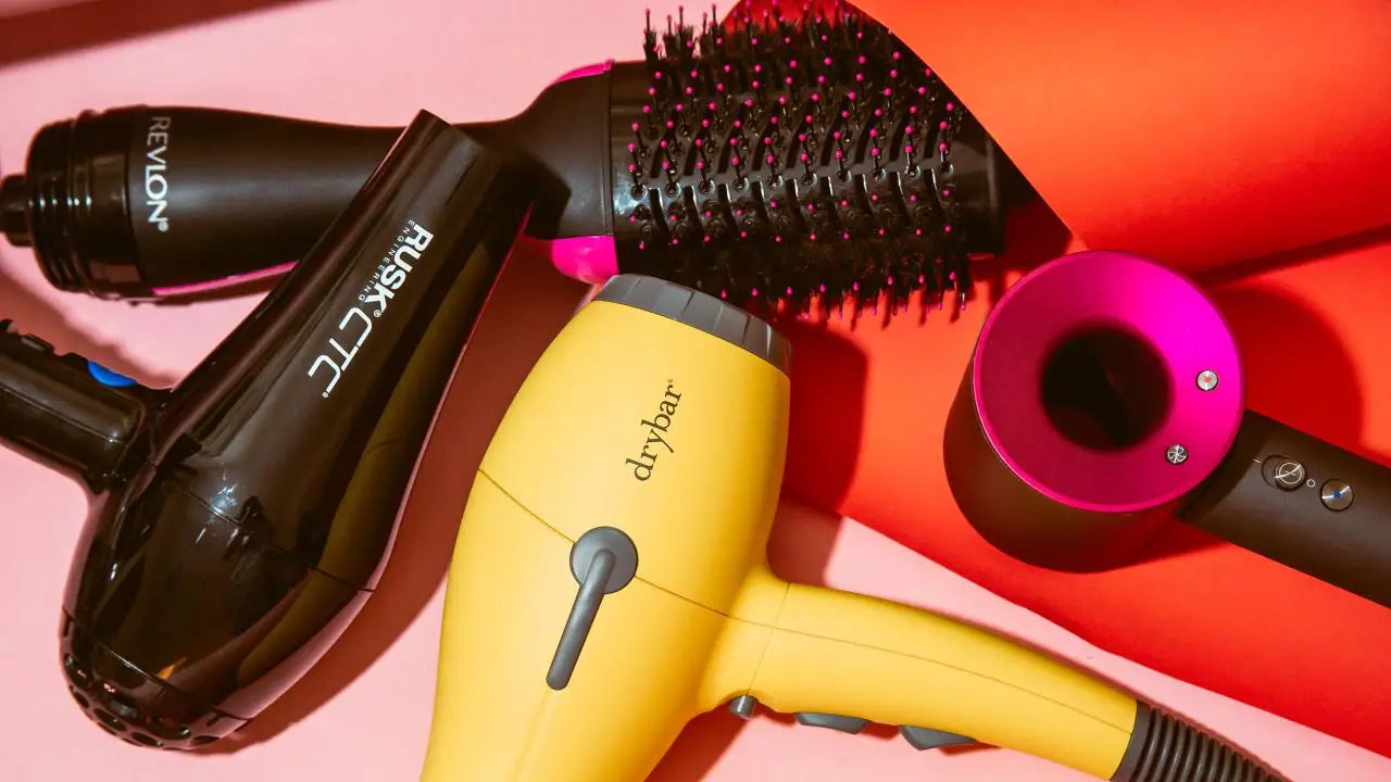 Yellow hair dryer with other hair styling tools, part of the ’Hair Dryers’ collection.