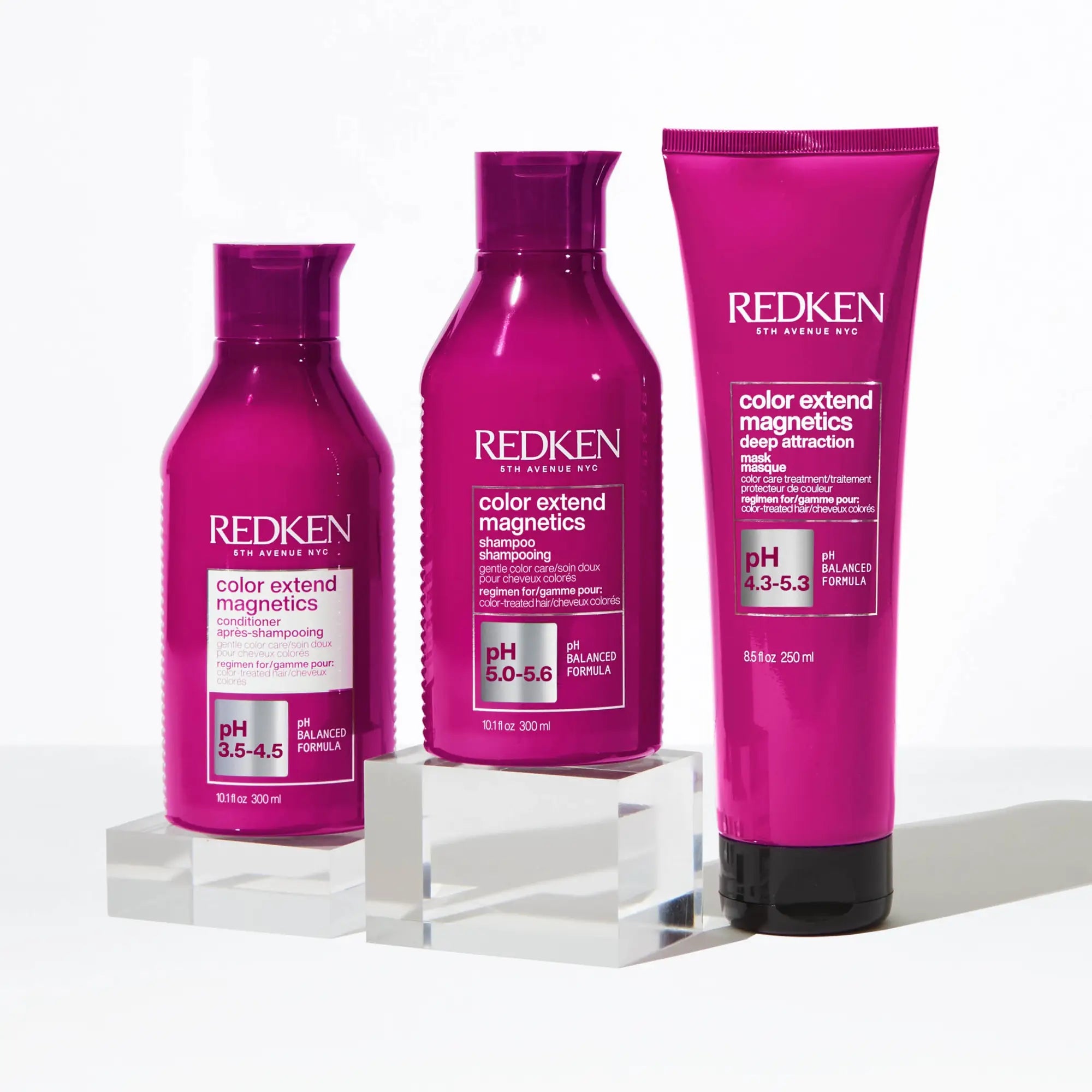 Three pink bottles of Redken Color Extend Magnetics hair care in the ’Redken For Colour Treated Hair’ collection.