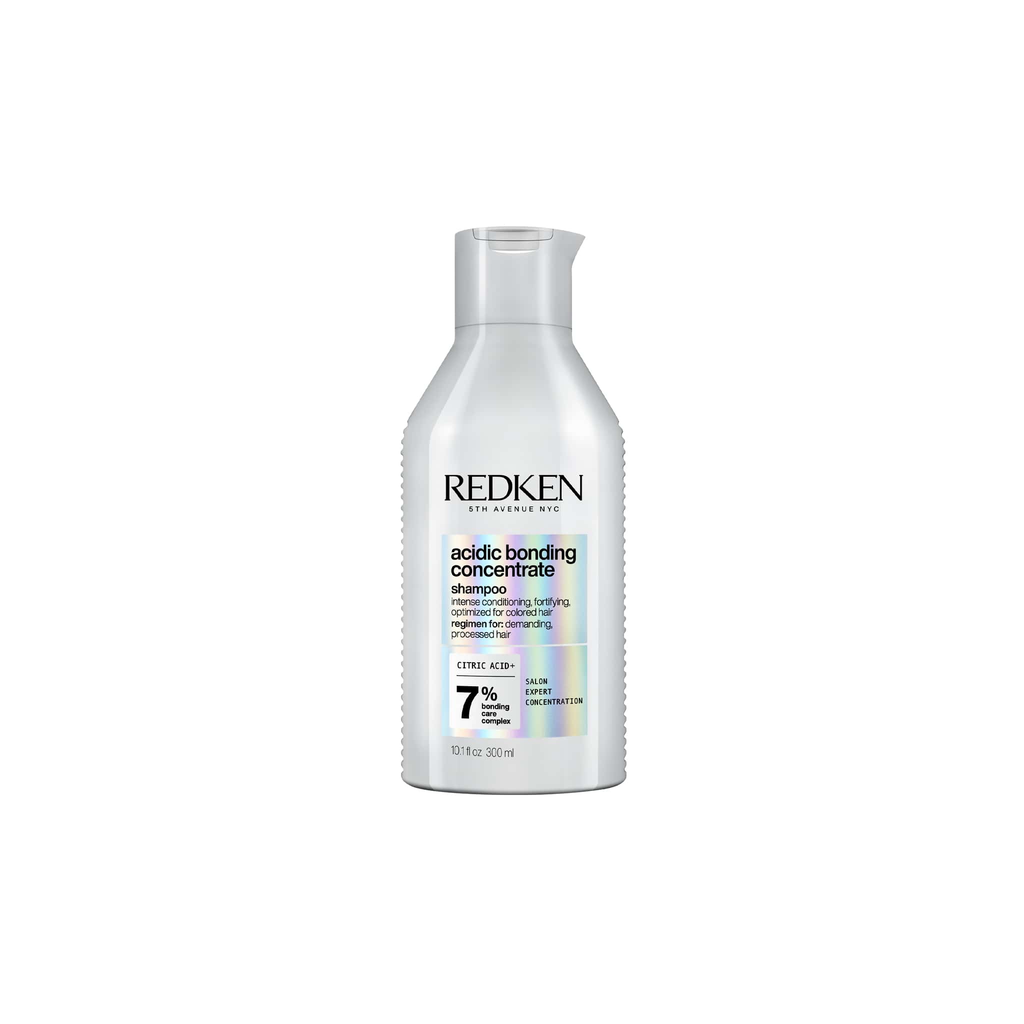 White bottle of Redken acidic bonding concentrate shampoo for damaged hair collection.