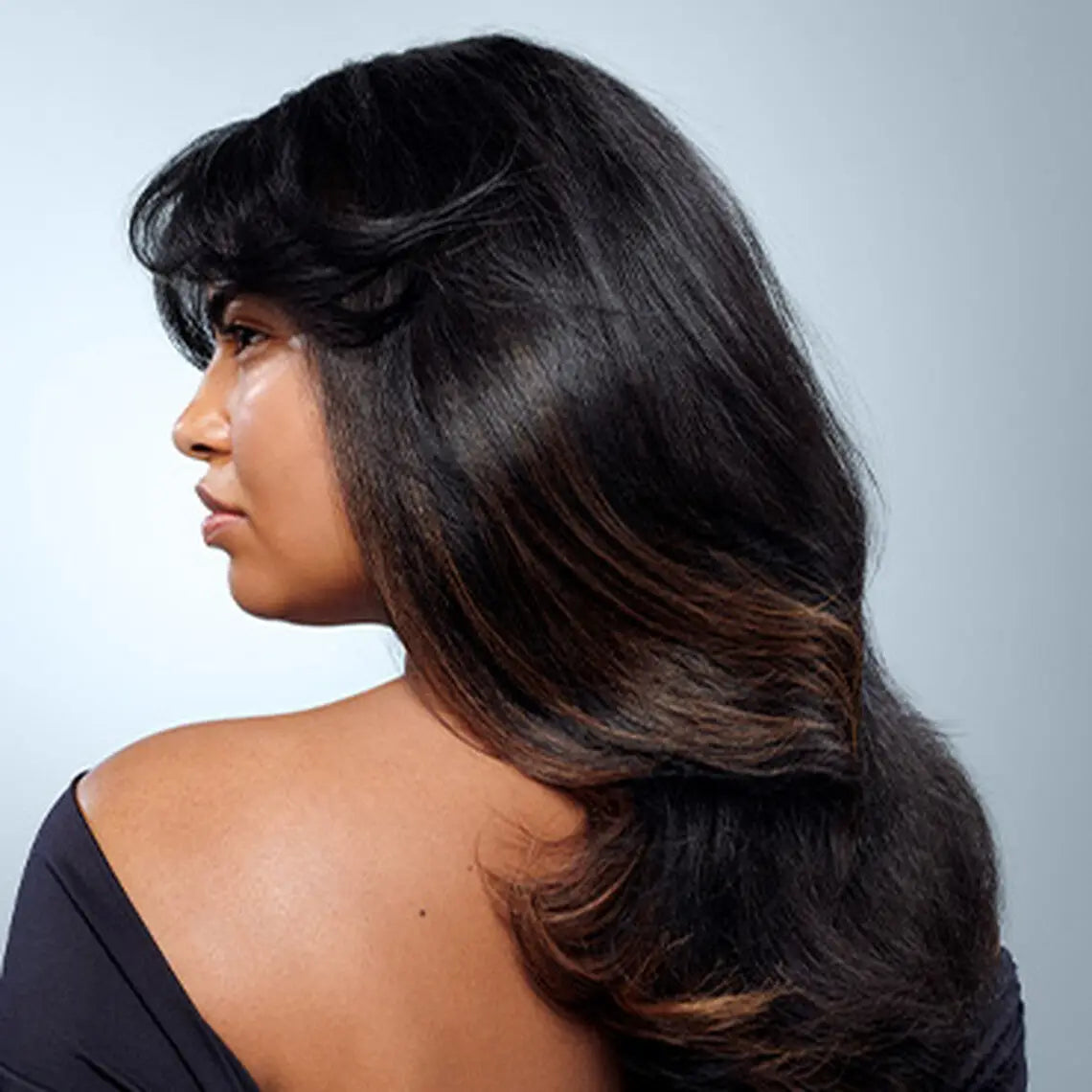 Loose waves, dark hair with brown highlights using Redken For Dry Hair leave-in treatment.