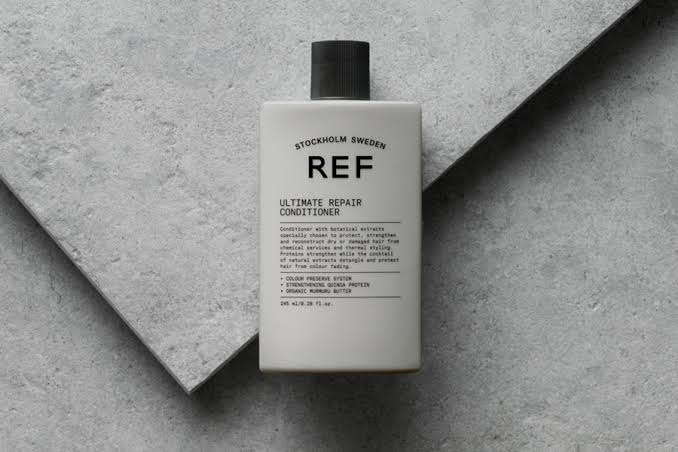 Bottle of REF Ultimate Repair Conditioner from Sweden, part of the REF hair care collection.