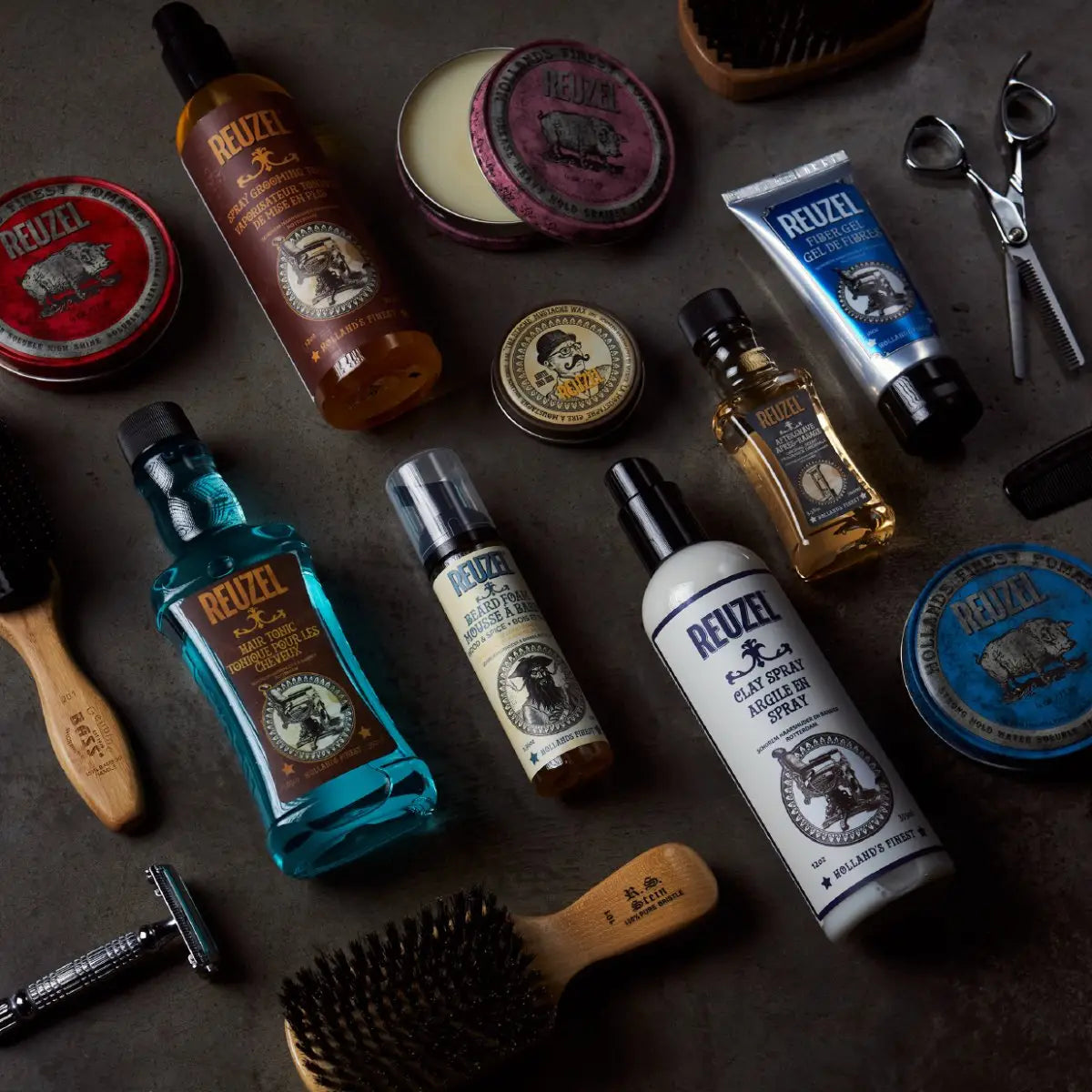 Collection of Reuzel beard and styling products for men with hair care tools.