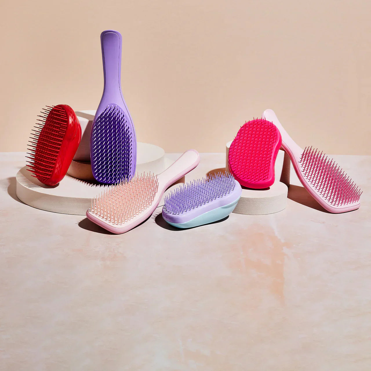 Collection of Tangle Teezer Detangling Hair Brushes in various shapes and styles.