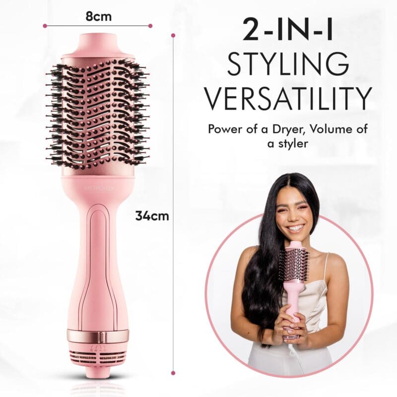 Pink cylindrical hair styling tool with a round brush head and metallic accents.