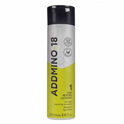 Bottle of Admino 18 hair removal cleanser with yellow and gray design.