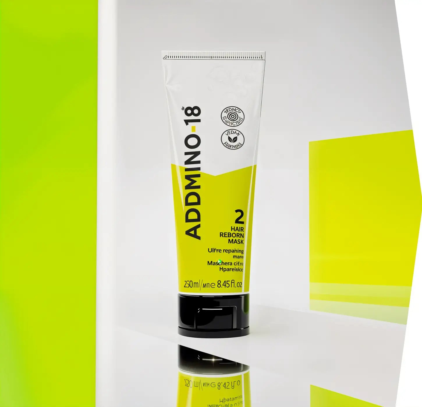 Tube of Addmino 18 hair product with yellow and white packaging.